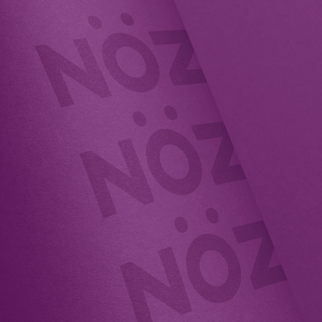 Close up of the bottle for NÖZ sunscreen in the color purple