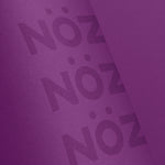 Load image into Gallery viewer, Close up of the bottle for NÖZ sunscreen in the color purple
